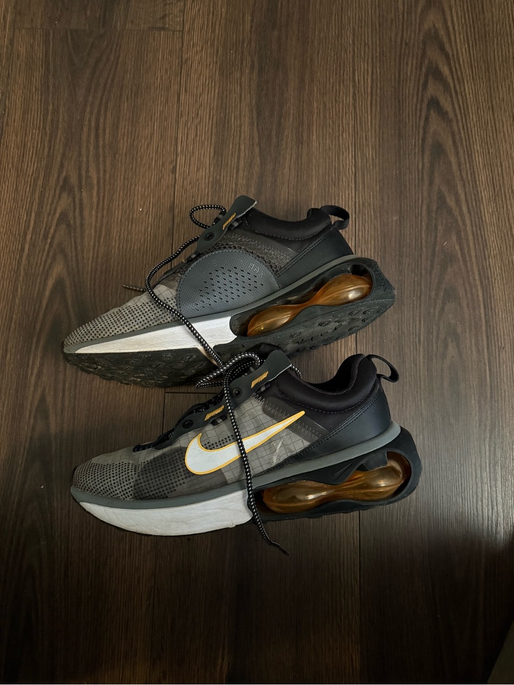 Nike Gray and Black Sneakers with Gold Accents
